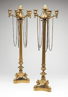 A pair of neoclassical gilt-bronze candelabra