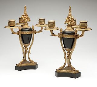 A pair of gilt-bronze and black marble candelabra
