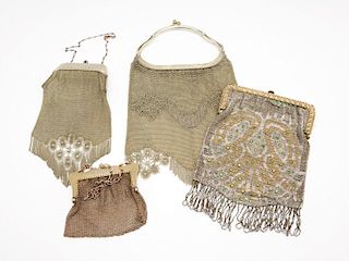 A group of four vintage and antique ladies purses