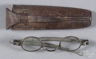 Coin silver spectacles, 19th c., marked J. S. Curtis, with a leather case.