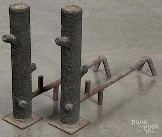 Pair of cast iron stump-form andirons, early 20th c., 20'' h.