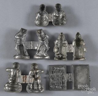 Five figural lead chocolate molds, to include a Santa Claus example.