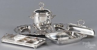 Four silver-plated serving pieces.