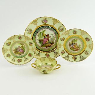 Thirty Eight (38) Piece Antique Continental Porcelain Partial Dinner Service. Transferred Gilt and Romantic Scenes Motif. The Set Includes: 12 Handled