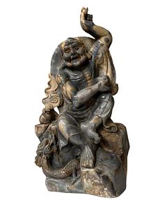 A Carved Jade Deity Statue
