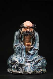 A Shiwan Immortal Figurine
