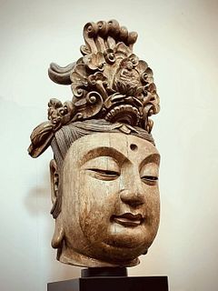 A Carved Wooden Guanyin Head. Height: 100cm