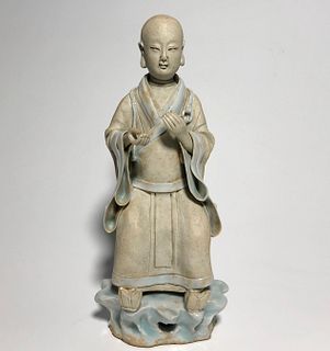 A Porcelain Arhat Figurine. Height: 23.5 cm