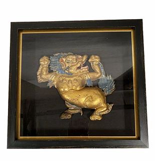 A Framed gilt copper Repoussé snow lion, Tibet, ci