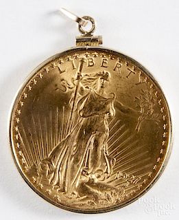 Saint-Gaudens gold twenty dollar coin, 1927, AU-UNC, inset in a bezel.