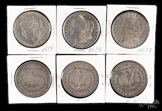 Ten Morgan silver dollars, to include three 1878 and two 1878 S (seven feathers), four 1879