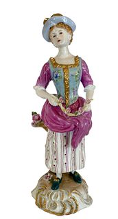 Fine Hand Painted Porcelain Figurine of a Lady with Flowers