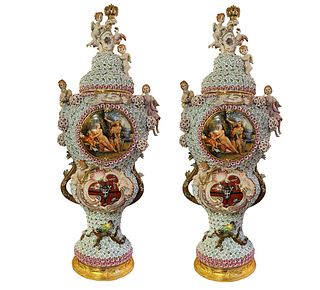 A Pair of Monumental Hand Painted Porcelain Flower Encrusted ''Cherubs'' Vases