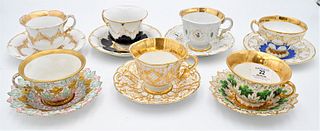 Seven Meissen Cups and Saucers, marked with crossed swords, cup height 2 3/4 inches, diameter 4 inches.