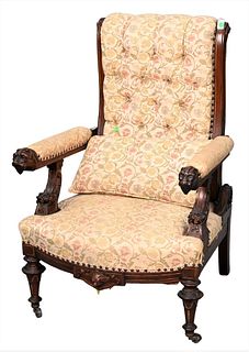 Renaissance Revival Victorian Walnut Reclining Chair, having carved head hand rests, upholstered seat and back, set on turned legs, height 42 inches.