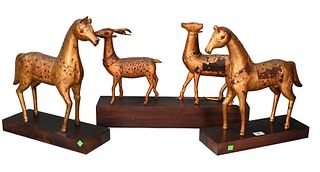 Set of Four Carved and Giltwood Tibetan Animals, to include a pair of horse's mounted with colored glass jewels on wood bases along with two deer on a