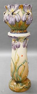Large Majolica Jardiniere on Stand, having molded iris or orchids, marked on bottom, similar to Delphin Massier, height 44 inches.