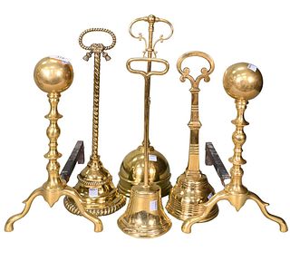 Four Victorian Brass Door Stops, along with a pair of brass andirons, tallest 18 inches.