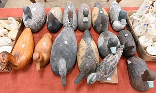Group of 14 Duck Decoys, to include carved wood, painted cork, etc, largest 14 1/2 inches.