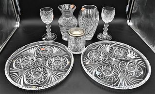 Eight Piece Waterford Crystal Group, to include two large chargers signed in script, two vases, two part punch bowl, two stemmed glasses and a biscuit