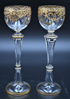 12 Tall Stemmed Moser Champagne Glasses, having applied gold decoration, height 8 1/2 inches.