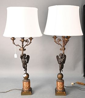 Pair of Three Light Candelabras, having winged putti standing on a ball on base, having embossed wreath and figures made into table lamps, height 37 1