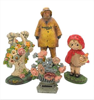 Group of Iron Doorstops, to include Fisherman, Hubley Little Red Riding Hood, and two floral baskets, tallest 15 inches.
