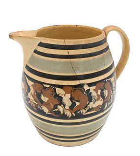 Mocha Jug, having banding and tri-color cable design, fine cracks and small chips.
height 7 inches.