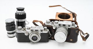 Two Leica DRP Ernst Leitz Cameras, IVR 610882 and No 424891; along with camera lenses, leather cases, Pentax camera and parts, etc.