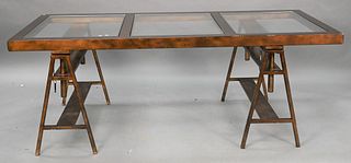 Contemporary Metal Table, having sawhorse base with glass top, adjustable height, height 26 1/2 inches, 31 1/2" x 71".