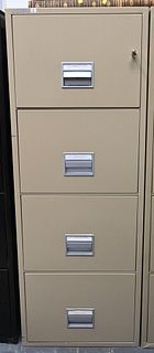 Schwab Four Drawer Fireproof File Cabinet, height 53 1/2 inches, width 19 1/2 inches.