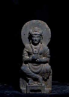 A Carved Stone Seated Bodhisattva Statue