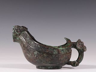 A Bronze Mythical Beast Shaped Vessel