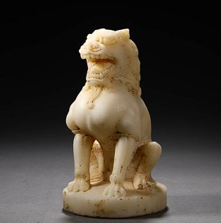 A Carved White Jade Lion Figurine
