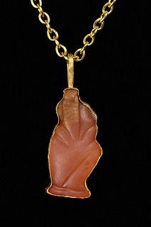 EGYPTIAN CARNELIAN HORUS AS CHILD AMULET IN LATER GOLD PENDANT