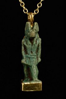EGYPTIAN FAIENCE AMULET OF ANUBIS IN LATER GOLD PENDANT