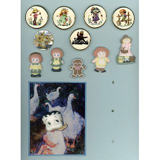 A CARD OF ASSORTED CERAMIC STUDIO BUTTONS