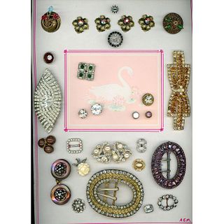 A CARD OF ASSORTED BUTTONS AND BUCKLES