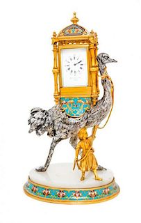 * A French Gilt and Silvered Bronze and Champleve Figural Clock Height 9 1/2 inches.