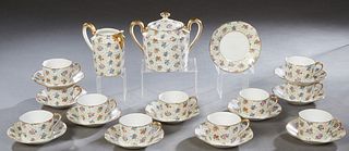 Twenty-Five Piece French Limoges Porcelain Coffee Set, 20th c., by B-D, consisting of 11 cups, 12 saucers, a cream pitcher and a covered sugar bowl. S
