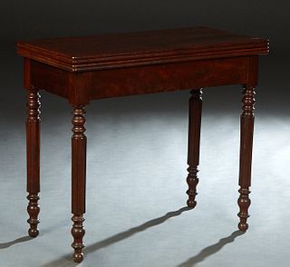 Louis XVI Style Carved Walnut Games Table, the reeded edge top opening to a circular green baize lined gaming surface, on turned tapered reeded legs, 