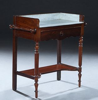 French Carved Cherry Louis XVI Style Marble Top Washstand, c. 1900, with a figured white marble splash and top, over a frieze drawer, flanked by turne