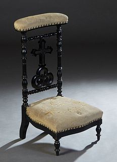 French Ebonized Beech Prie Dieu, c. 1870, the curved padded arm rest over a cruciform back splat and an upholstered bowed seat monogrammed "MC," dated