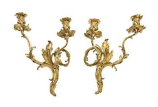 A Pair of Louis XV Style Gilt Bronze Two-Light Sconces Height 14 1/2 inches.