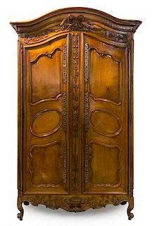 A French Provincial Walnut Armoire Height 101 x width 57 1/2 x depth 25 3/4 inches.