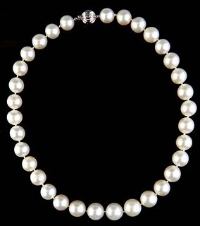 Graduated Strand of Thirty-three White Tahitian Cultured Pearls, ranging from 12-14mm, with a 14K white gold ball clasp, L.- 18 1/2 in., with appraisa