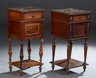 Near Pair of French Carved Walnut Marble Top Nightstands, early 20th c., the inset highly figured marble over a frieze drawer and a pot cupboard door,