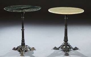 Pair of French Cast Iron Marble Top Bistro Tables, the circular top on a reeded knopped support to tripodal paw feet, one with a verde antico marble, 