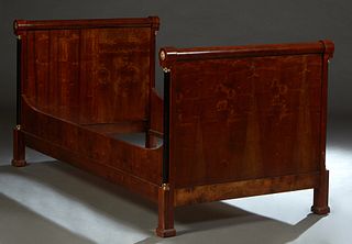 French Empire Style Bronze Mounted Mahogany Day Bed, 19th c., the rolling pin top head and foot board with bronze floriform end mounts, over ormolu mo