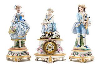 * A Continental Bisque Porcelain Three-Piece Clock Garniture Height 18 3/4 inches.